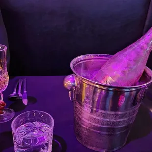 a bottle of champagne in an ice bucket