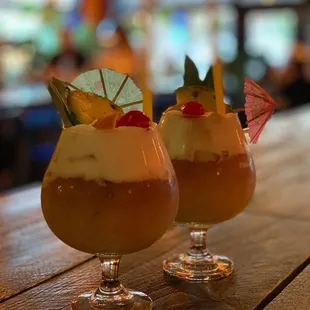 two cocktails on a bar
