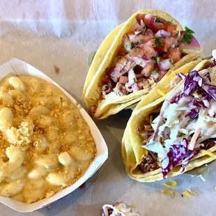 Mac and cheese Pulled pork taco with pico, onions, and cilantro  Brisket taco with cheddar cheese and slaw