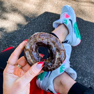 a person holding a donut