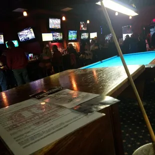 The back room has big bar and all the pool tables and more dart boards...