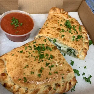 two pieces of pizza in a box