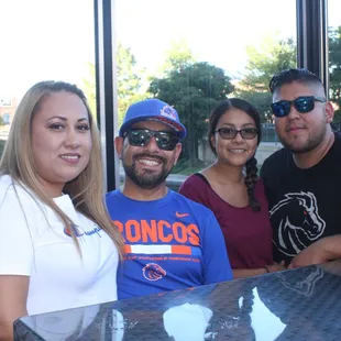 a group of people sitting at a table