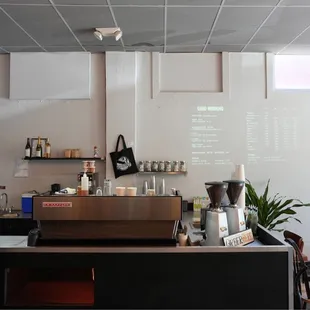 a woman standing in a coffee shop