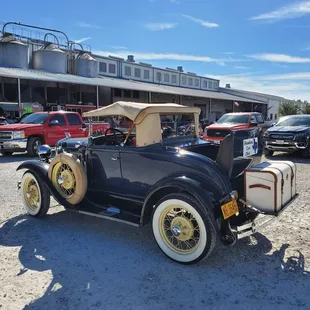 an antique car in a parking lot
