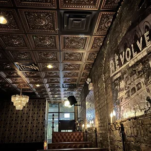 the interior of a bar with a brick wall