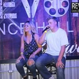 a man and a woman on stage
