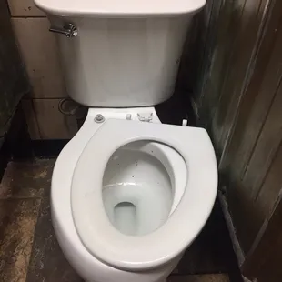 Broken seat with dirty bowl