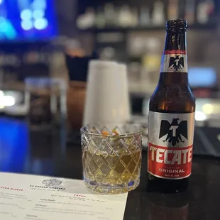 a bottle of beer and a glass