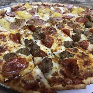 Hawaiian, pepperoni and sausage pizza