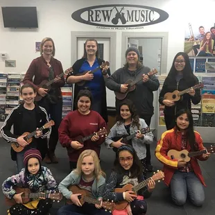 All smiles after a fun group ukulele class!
