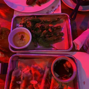 two trays of food on a table