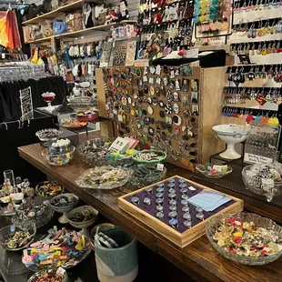Counter display of earrings, pins, and others.