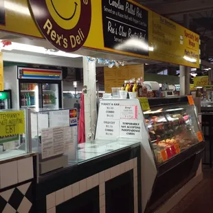 a smiley face sign in a deli