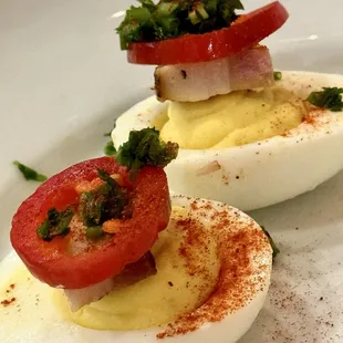 Deviled eggs with candied bacon and red jalapeño