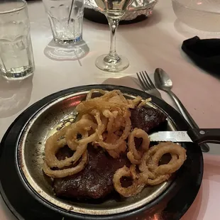 Flat Iron Steak with haystack onions and garlic butter