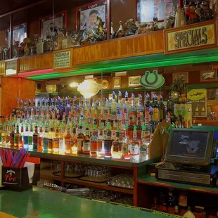 a bar with a variety of drinks