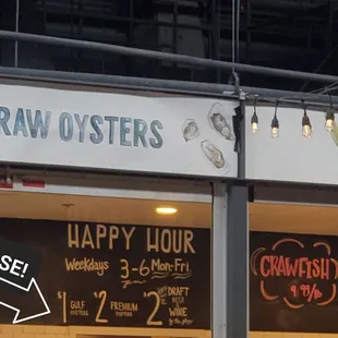 Outdated, misleading, and ambiguous advertising boards inside the restaurant.