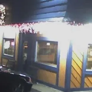 a car parked in front of a restaurant