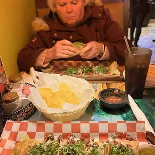 Street tacos on corn tortillas with chips and salsa