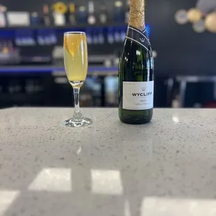 a glass of wine and a bottle of wine