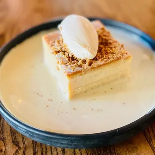 Increíble Guerra Cake!!! Layers of tres leches and flan with a dollop of cream on top. So good!!