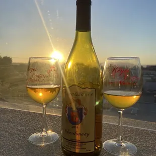 a bottle of wine and two glasses of wine