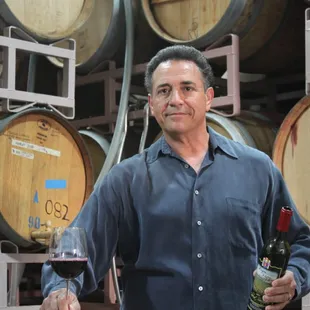 a man holding a glass of wine