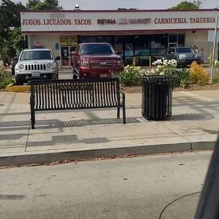 a bench in front of a store