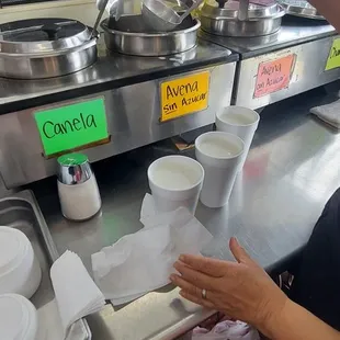 a woman preparing food at a counter