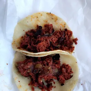 two tacos on a piece of paper