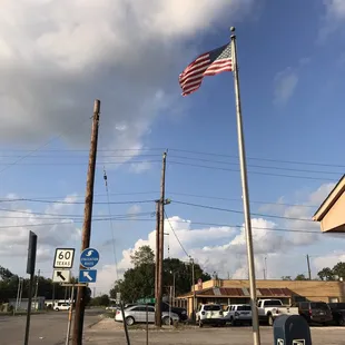 Look for tattered flag at post office across the adjacent street.