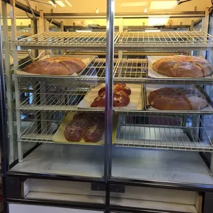 a display case filled with baked goods