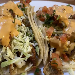 Fish tacos with tomato salsa and sauce. Really good size soft tortillas and love the cube size cut pieces of fish.