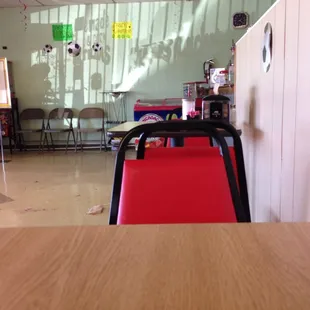 a table with a red chair