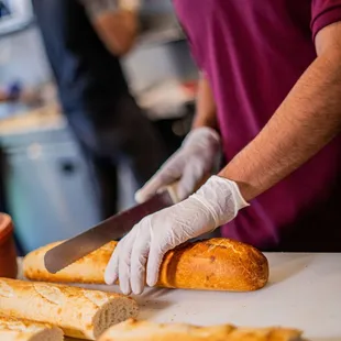  a man slicing bread