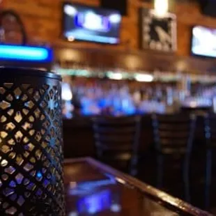 a view of a bar with blue lights