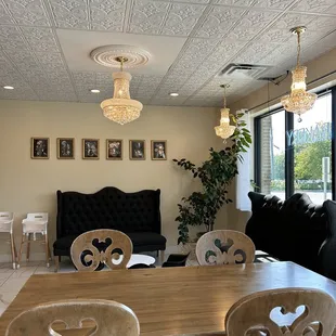 a living room with a dining table and chairs