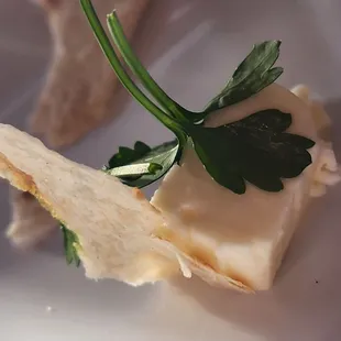 a piece of cheese with parsley