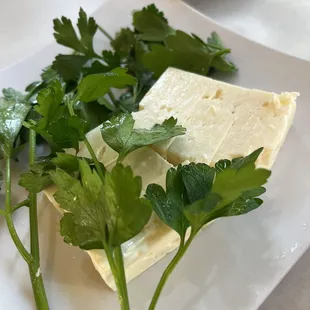 a plate of cheese and parsley