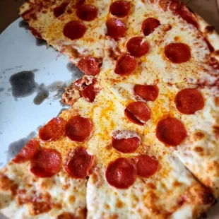 Uncooked pizza with too much cheese and not enough sauce