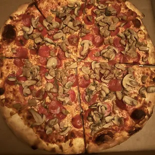 Large pizza with pepperoni, sausage, and mushroom