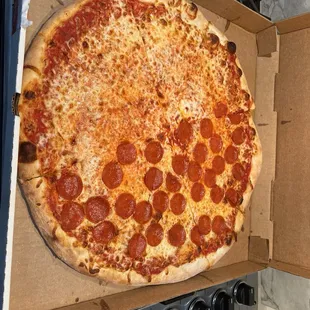 Our first pizza - half cheese half pepperoni