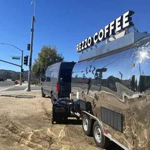 a truck parked in front of a coffee shop