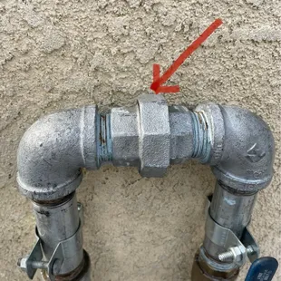 The riser installed with an arrow pointing to the hand tightened nut!