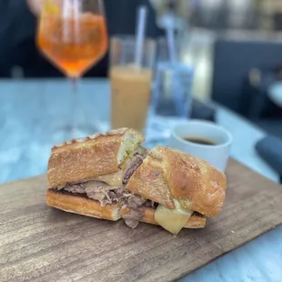 Shaved ribeye on charred garlic bread
