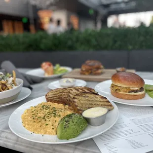 Scrambled eggs with avocado and toast, truffle fries, truffled grilled cheese, burger, &amp; lobster roll