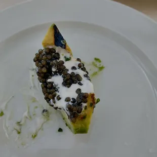 Grilled avocado with caviar and creme fresh