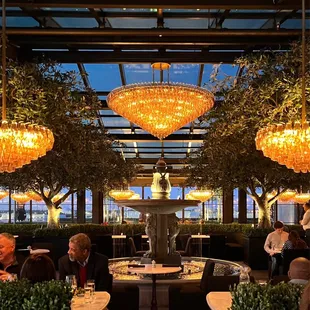 Running fountain in the center of the inside dining space.