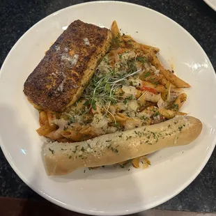 Primavista pasta with penne, salmon, and garlic marinara sauce